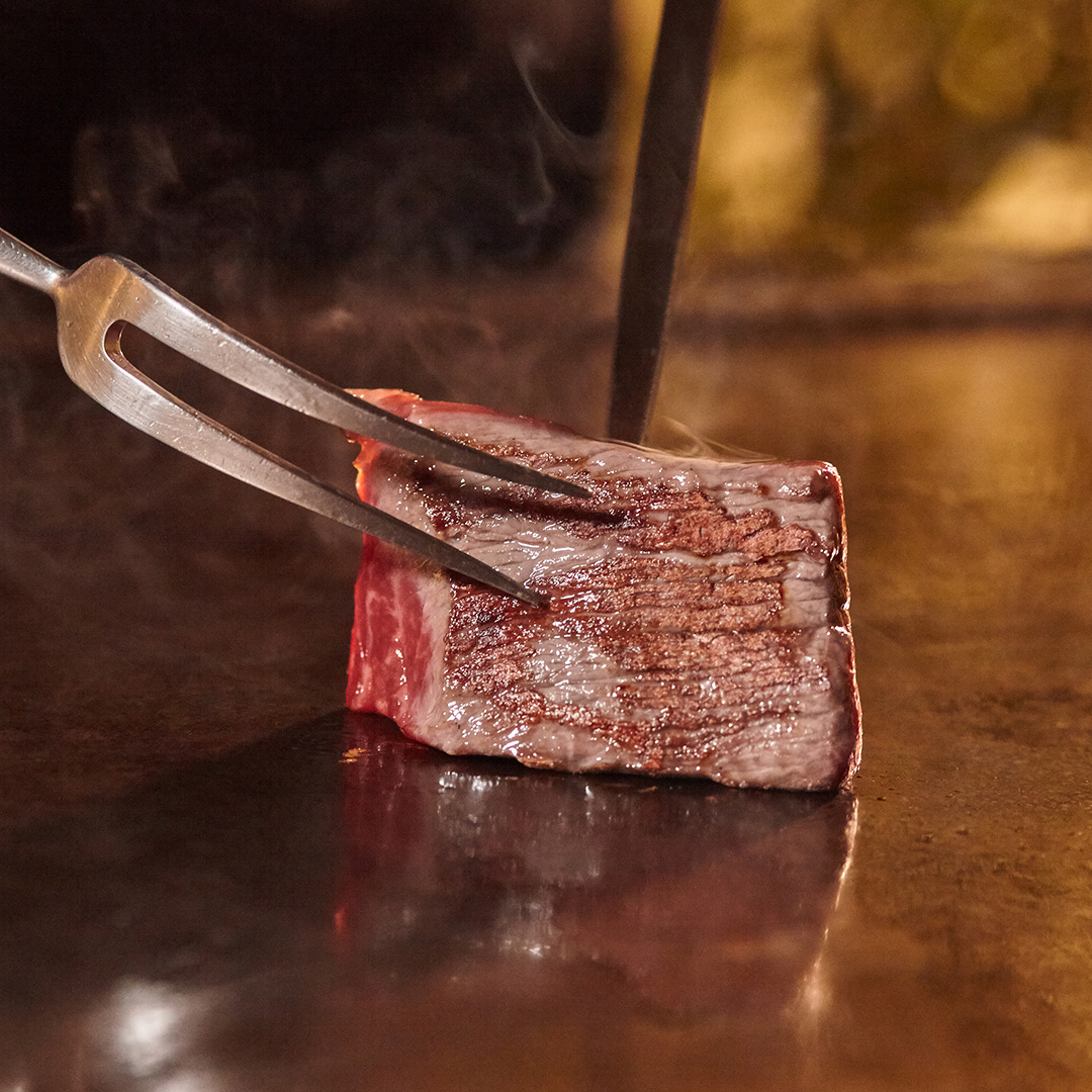 japan delicious asian food flame beef teppanyaki closeup fork restaurant menu